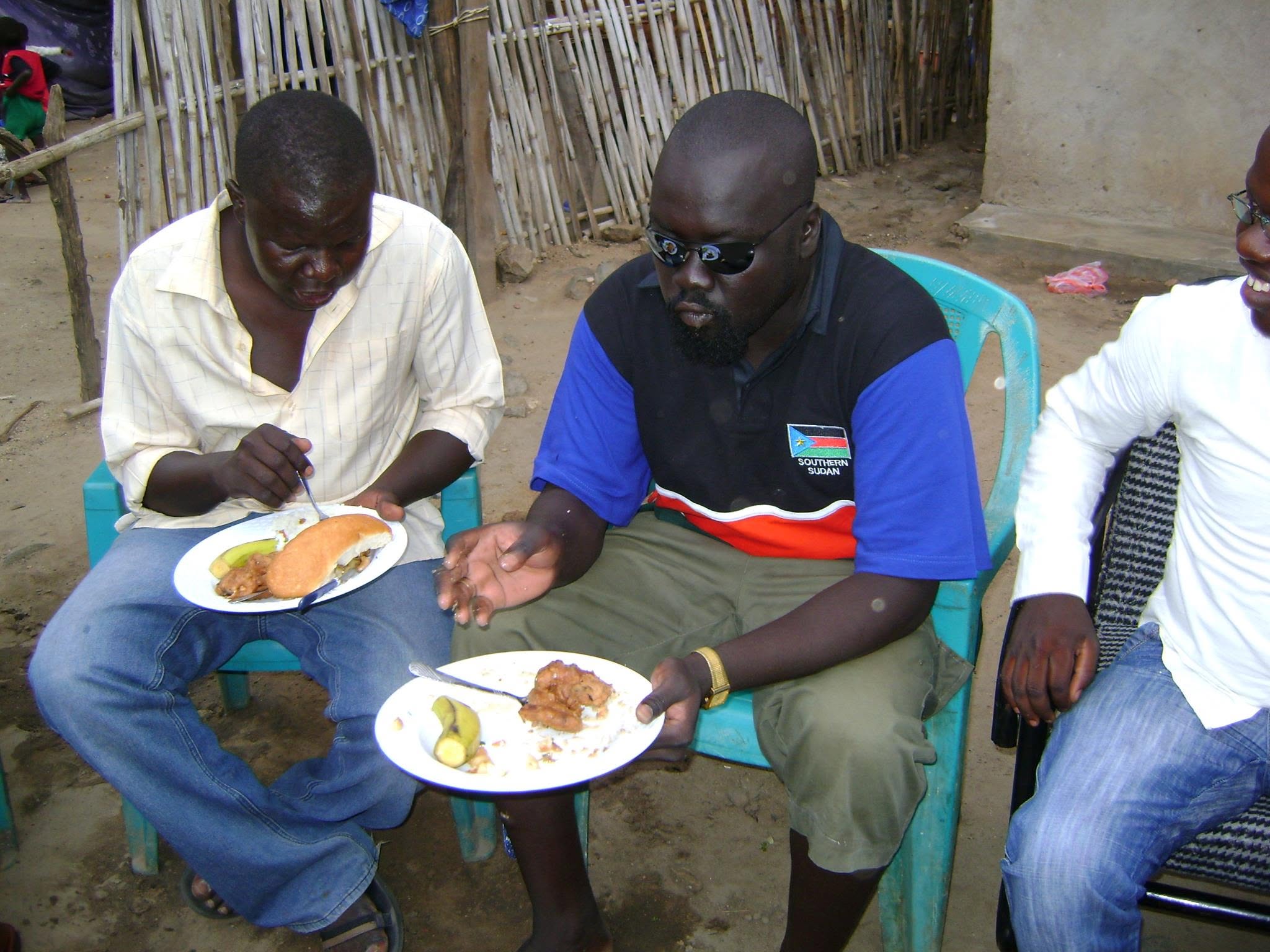 Hon. Yona Robert Mark and Labana seated together
