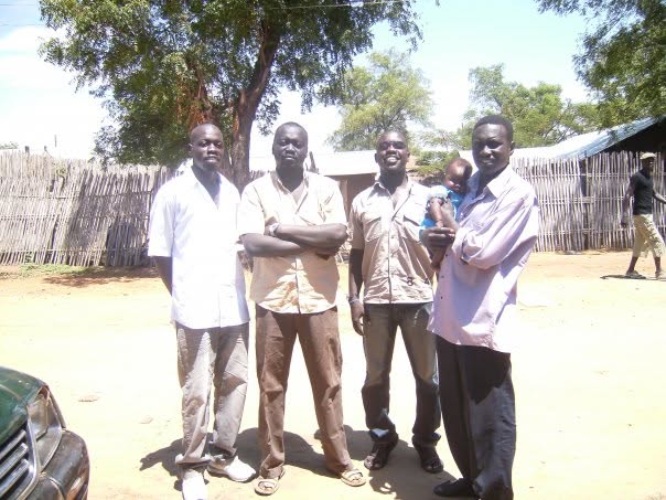 Matayo, Labanese, Musa and Ruben standing together