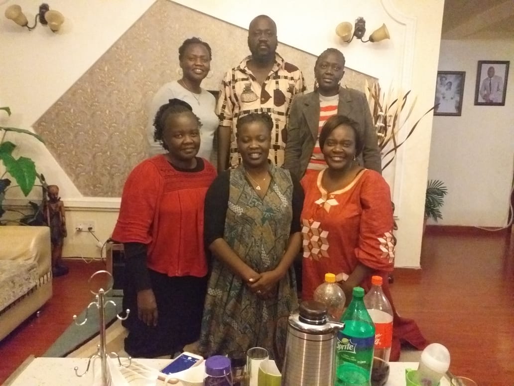 Labana with five women during a family reunion