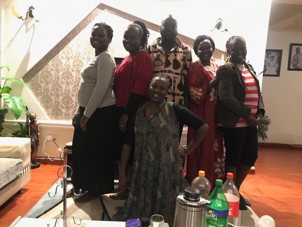 Labana posing with his five sisters during a family reunion