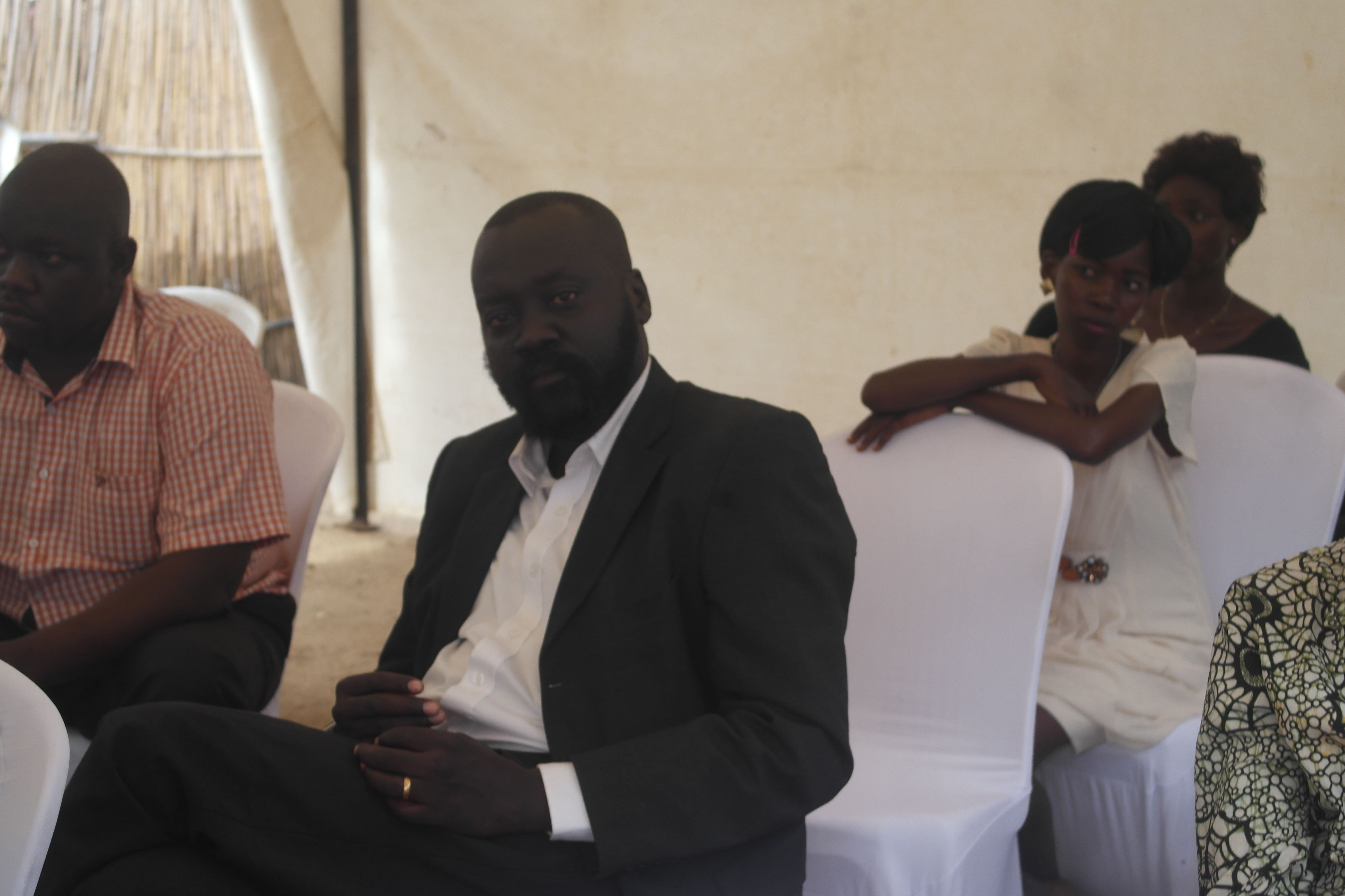 Labana seated among guests at a family gathering
