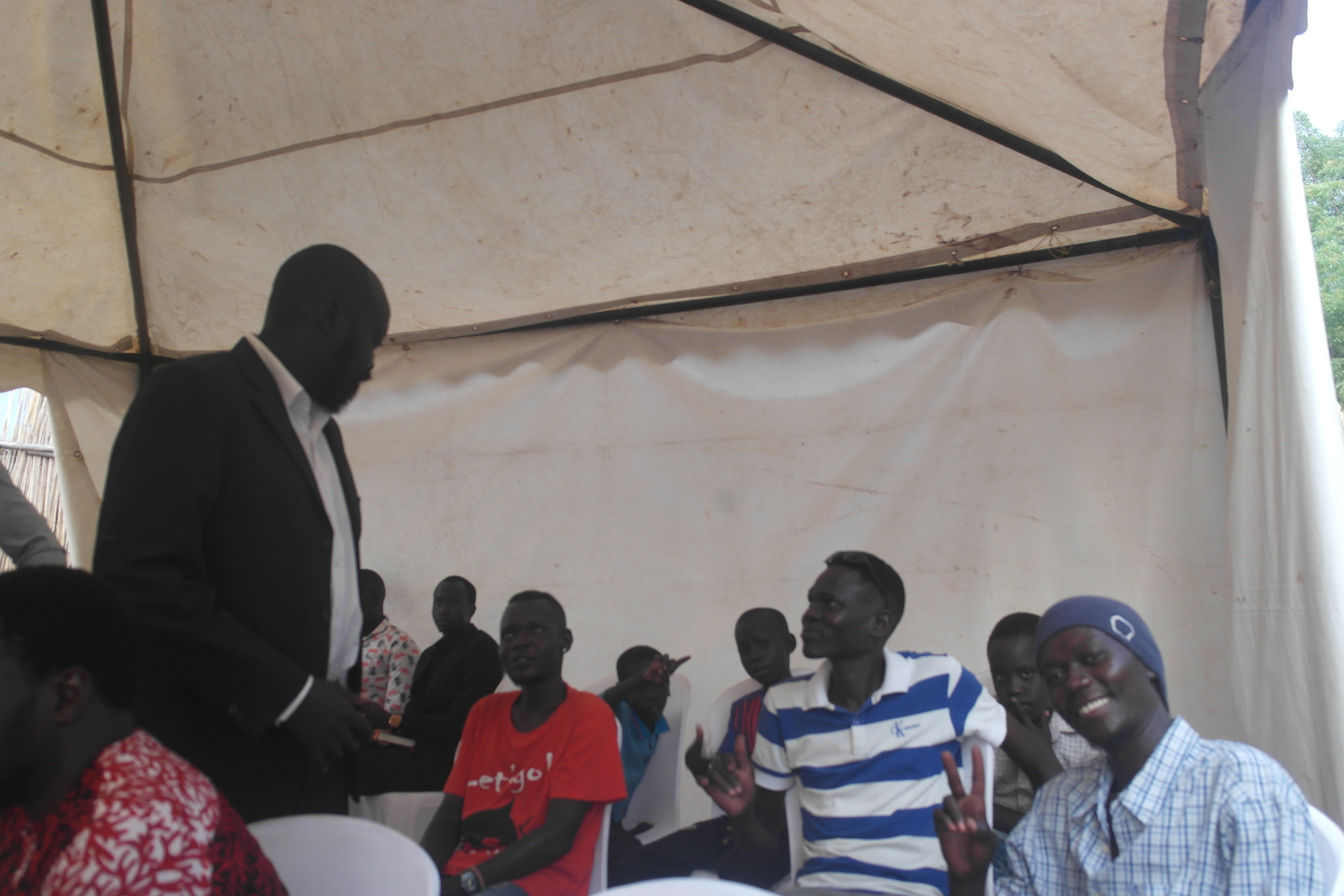 Labana among guests beneath a marquee