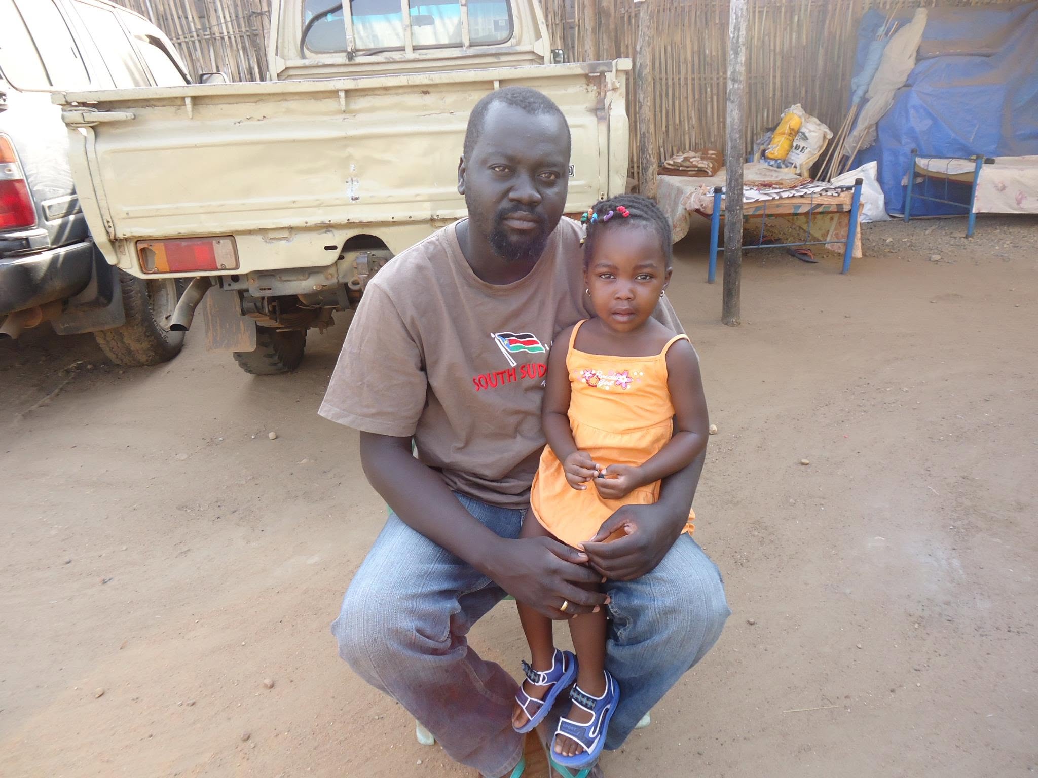 Uncle Labanese seated with Riya Nixon