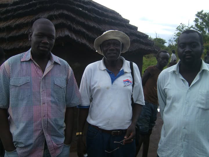 Yona, Uncle F. Warille and Labana standing outdoors in Lui